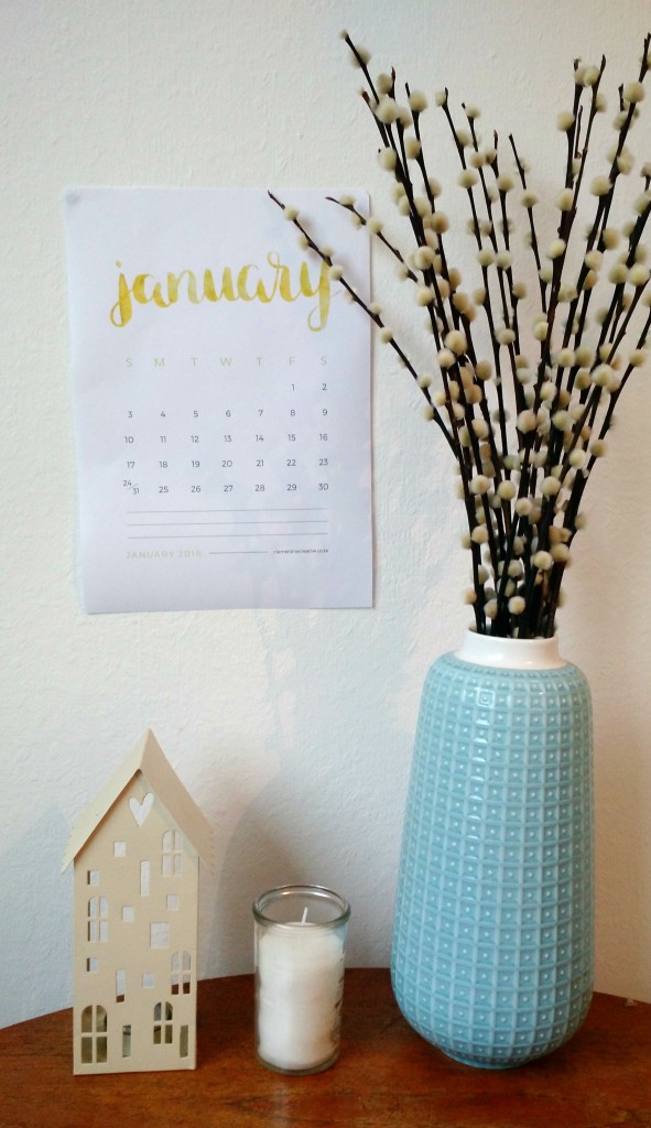 January calendar with blue vase on table